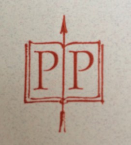 the letters P P displayed on the recto and verso pages of an open book, an upward arrow in the page gutter
